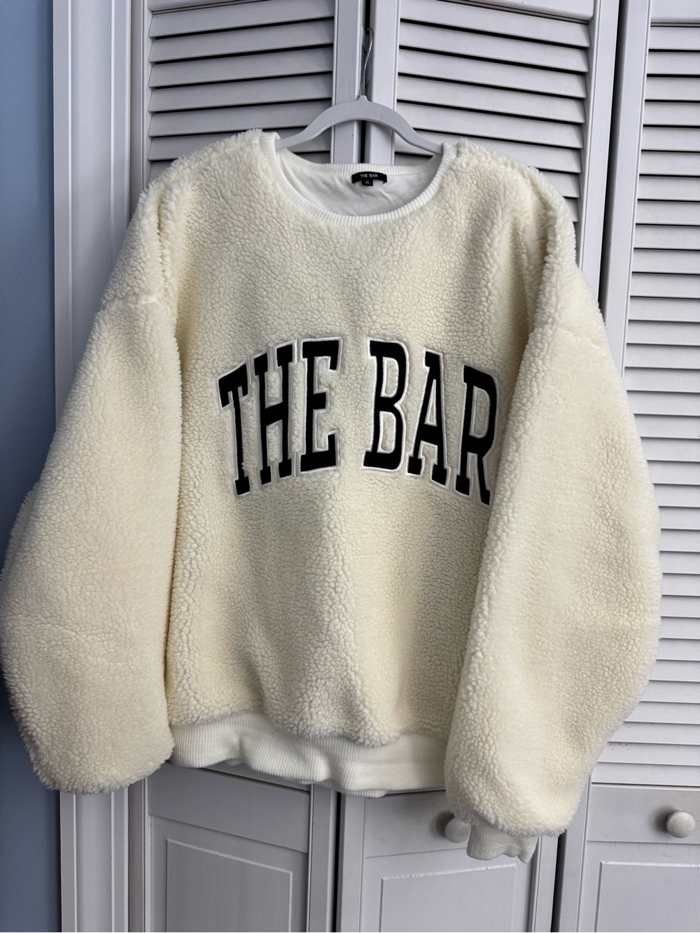 Cream Sherpa Sweatshirt with 'THE BAR' Lettering